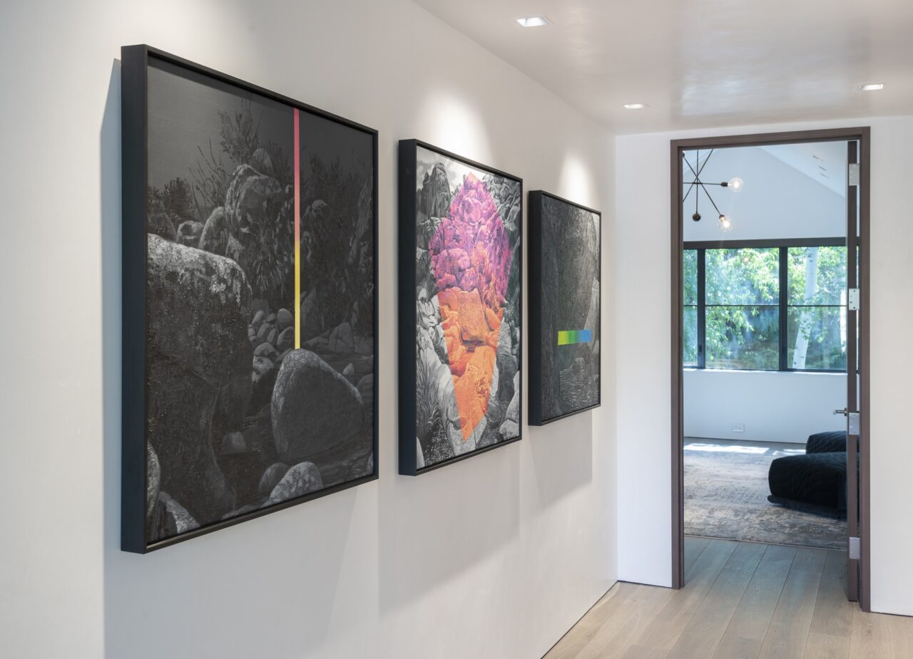 a white hallway with modern artwork